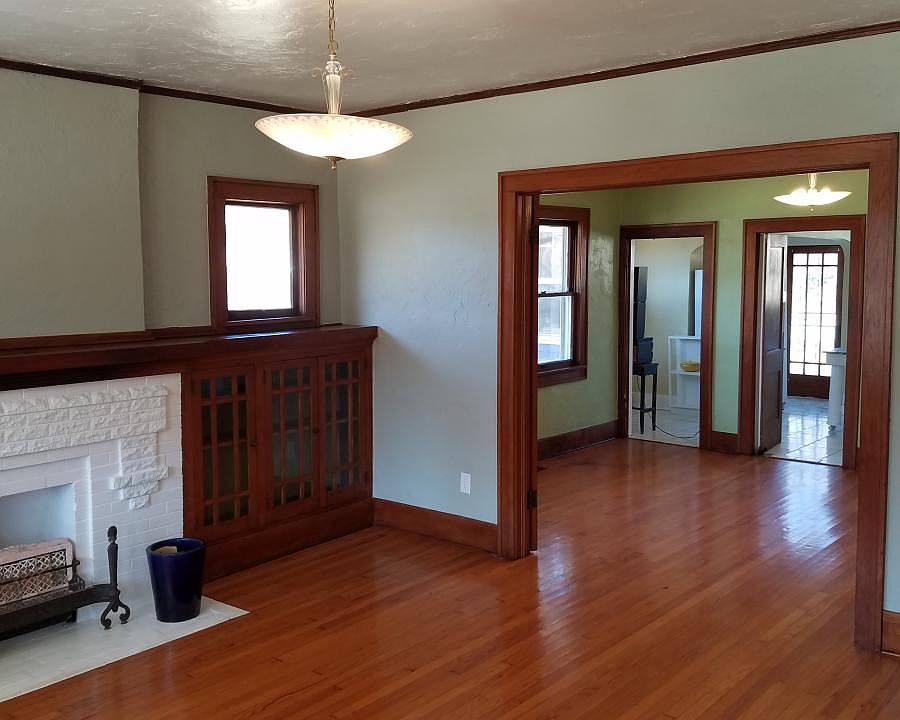 Gleaming original Historical Woodwork with Classic Lighting and Fireplace.