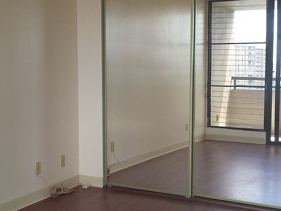 Living room with mirrored closet
