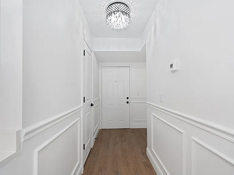 Step into elegance with this bright and welcoming entryway. Step into elegance with this bright and welcoming entryway.