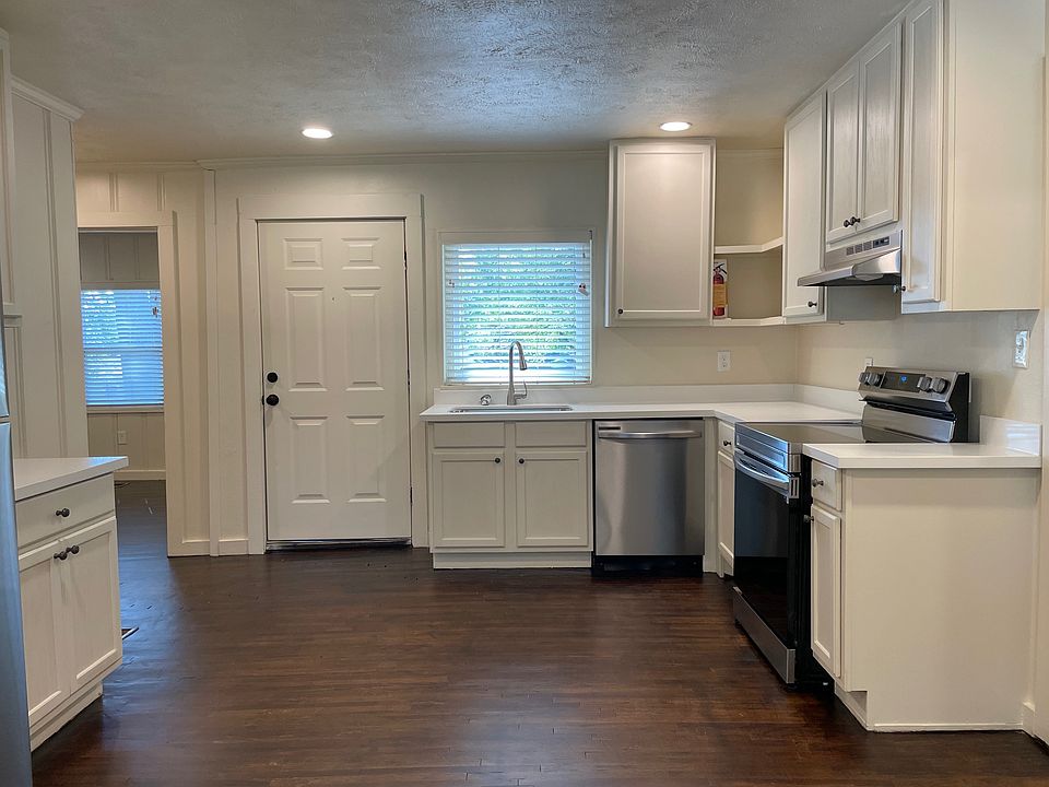 The updated kitchen has hardwood floors.