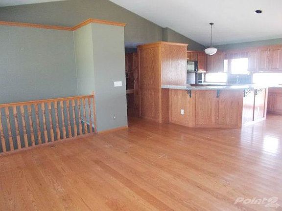 Living room/kitchen/open basement entrance from living room