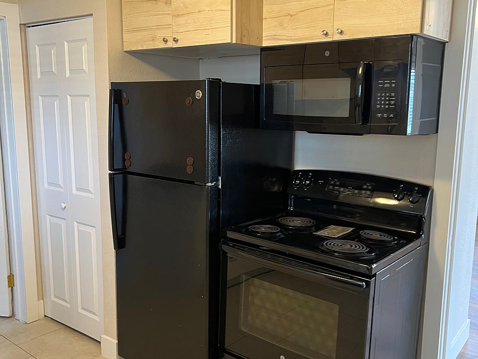 MICROWAVE, STOVE AND FRIDGE