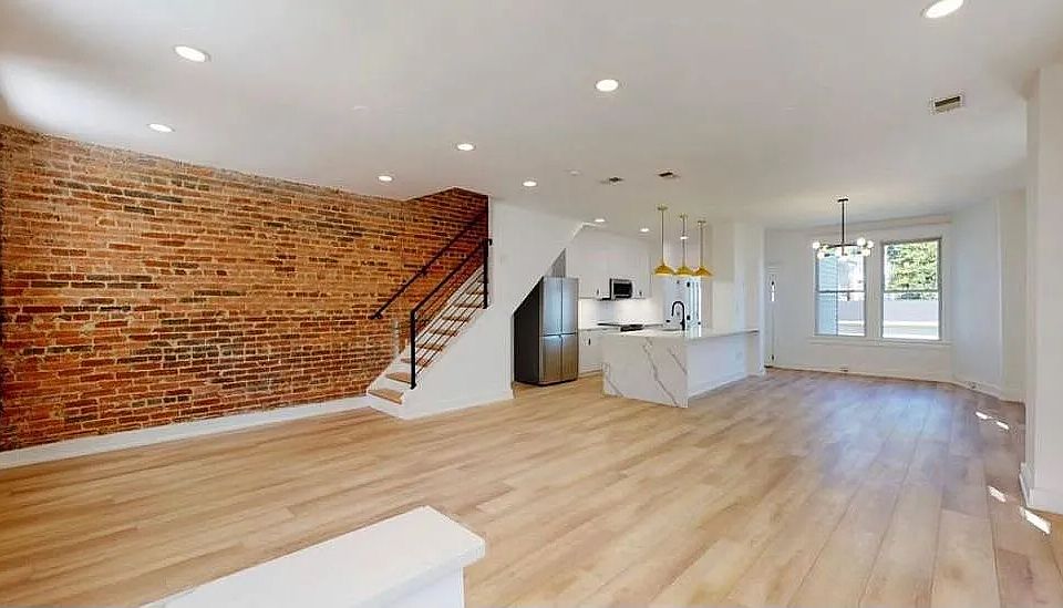 Open concept main level now with a furnished dining room.