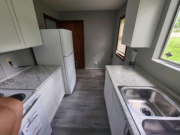 New kitchen floor, appliances, cabinets and counters.