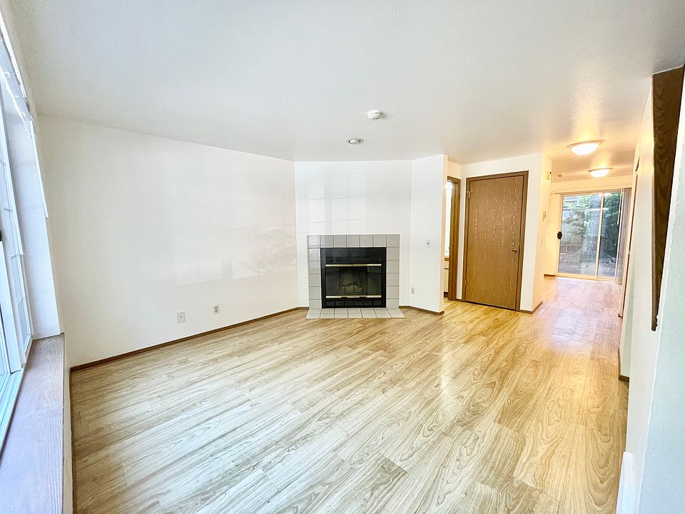 Living Room (note: fireplace to be removed). Coat Closet and access to half bath.