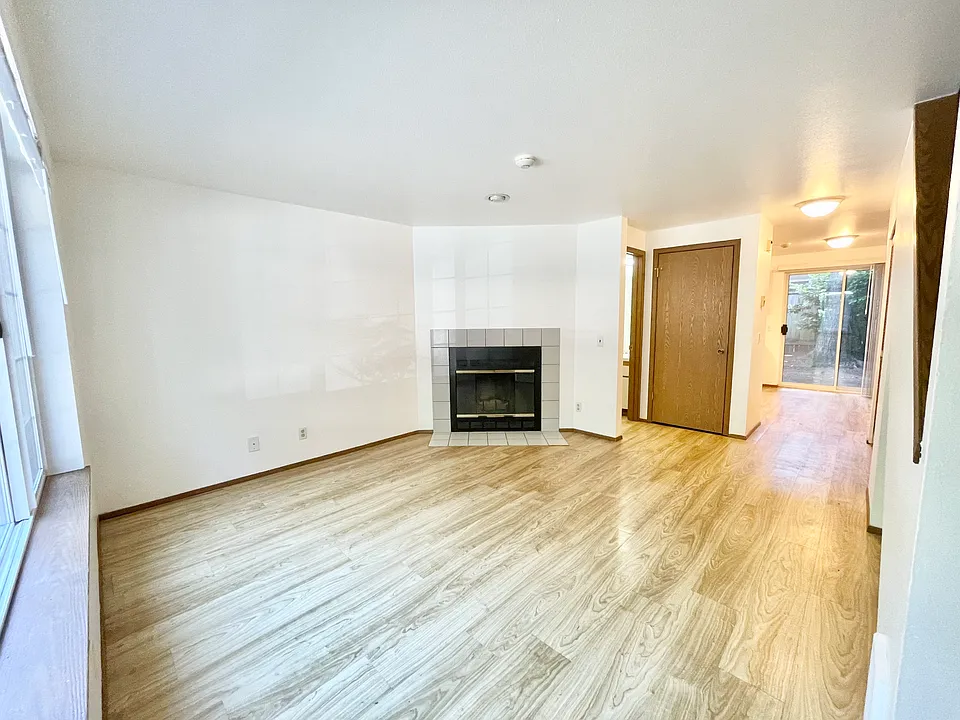 Living Room (note: fireplace to be removed). Coat Closet and access to half bath.