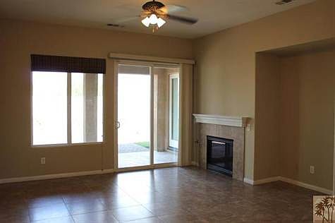 Great room tiled. In fact the entire home is tiled! Firepla