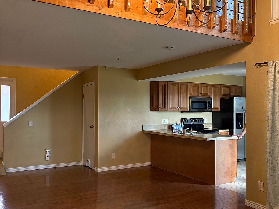 In livingroom, looking toward kitchen and dining space.
