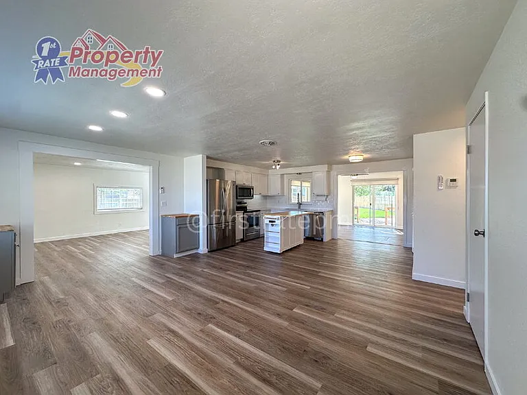 7703 S Mistyglen Ave — Photo 2