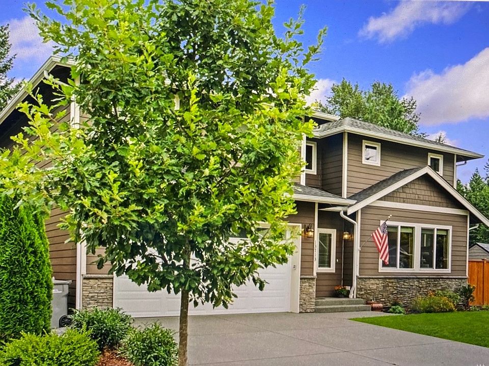 Front faces West with sidewalks and Oak lined street of seven homes in a culdesac.