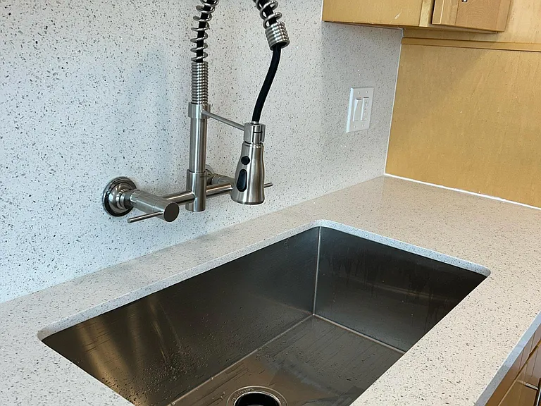 Designer stainless steel kitchen sink and faucet