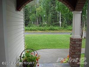 Brick accents on porch with slate floor