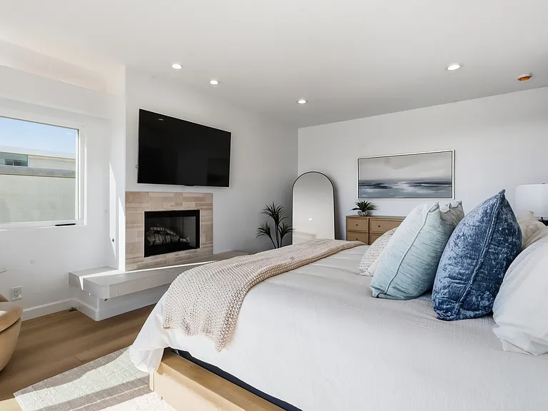 Primary bedroom features a covered balcony, fireplace, large spa bathroom, and incredibly spacious walk-in closet.