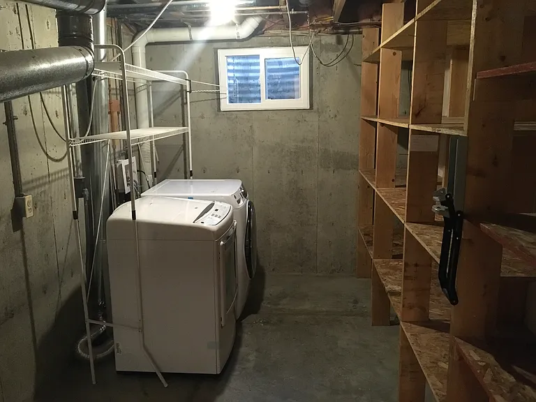 Washer and dryer in basement utility room