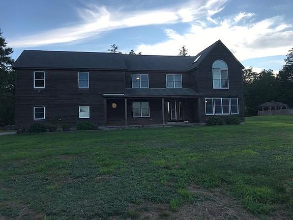 front view with large covered porch