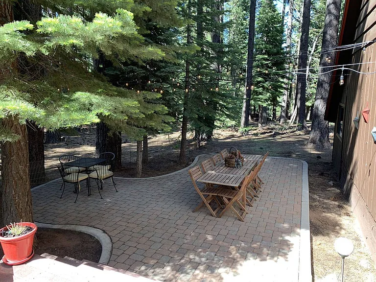 Rear Yard dining area with market lights and table/chairs included (summer)