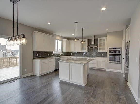 Upgraded Glass Tile Backsplash and Granite Counter Tops....
