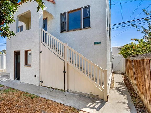 The second story front door with small patio.