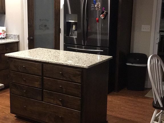 Beautiful open floor plan with open kitchen and plenty of cabinets.