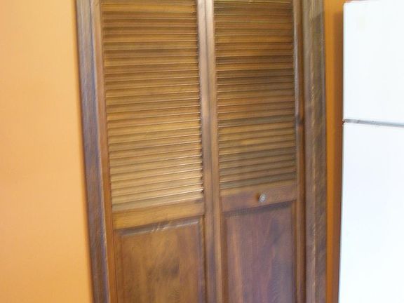 Laundry room door. Refrigerator pictured has been replaced with a newer stainless steel model with water filter & ice dispenser.