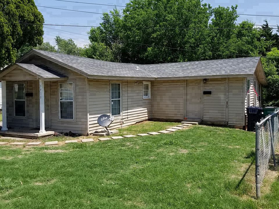 Outside view of duplex. Entrance on right.