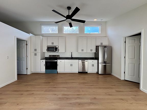 Full kitchen with new appliances (incl: oven, microwave, sink, dishwasher, & fridge).