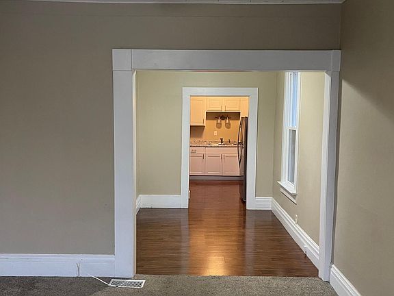 Family room through dining room to kitchen