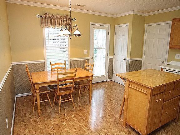 Eat-In Kitchen with access to the backyard.  Crown and Chair Molding are extra