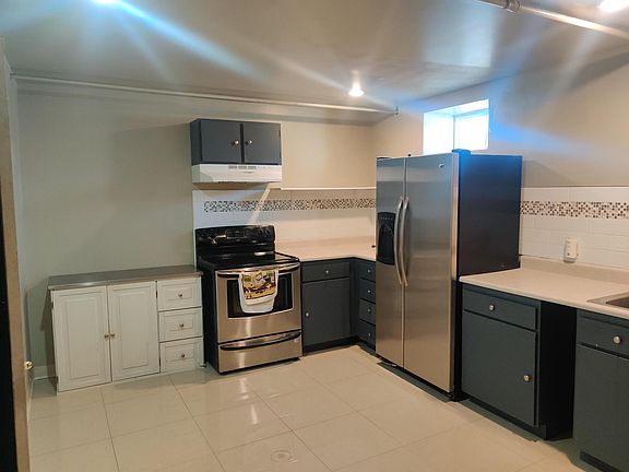 Spacious kitchen - to the left but not pictured: VERY spacious pantry area with additional storage area in the back corner