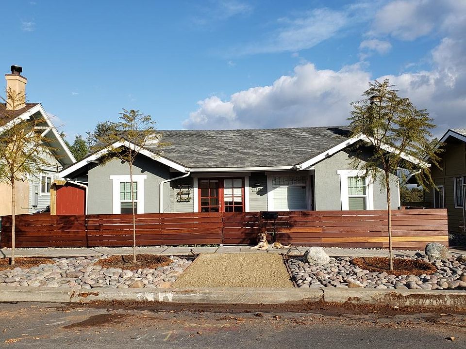 Street view of the main home, unit for rent has separate entrance around back. That's the house mascot, Gus.