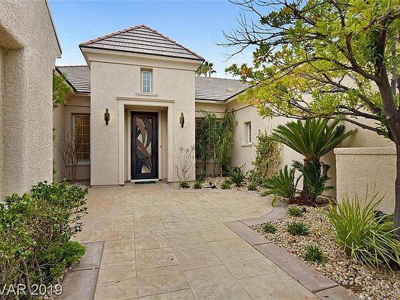 Courtyrard entry with custom gate and front door