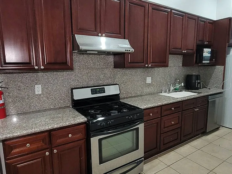Kitchen: Stove, dishwasher, fridge, plenty of cabinet space.