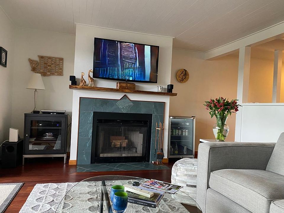 Wood-burning fireplace. TV over fireplace included with concealed wiring for hook-up.