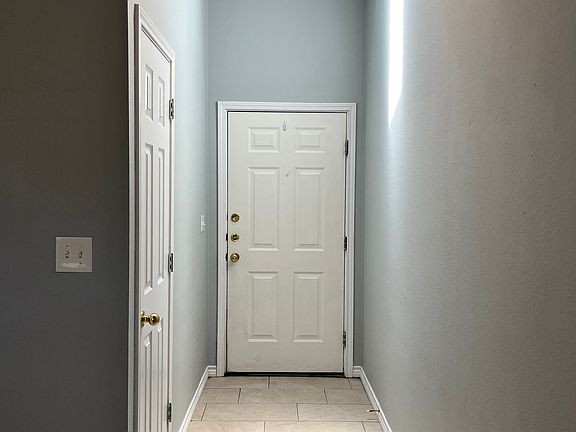 Entry Way with Skylight and entryway closet.