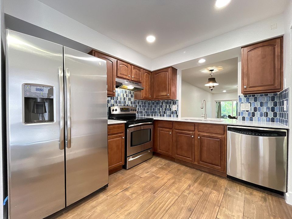 New Kitchen With Stainless Appliances, Quartz Countertops and Plenty of Lighting