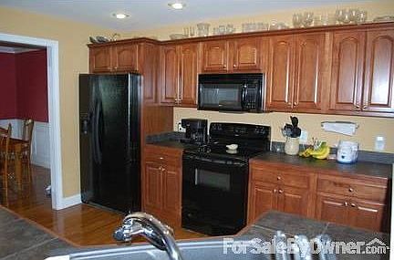 kitchen
						:
						Open to great room; has hardwood floors, black tile countertops, breakfast nook.