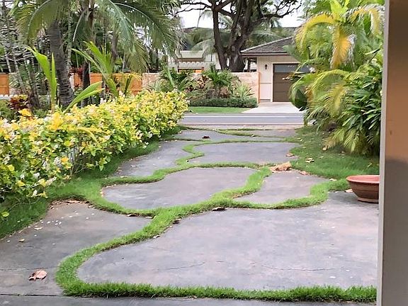 Driveway with carport. Level 2 electric car charger available