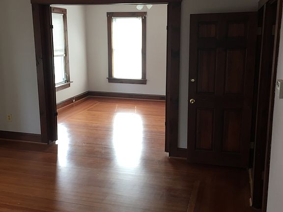 Unfurnished double living room with pocket doors.