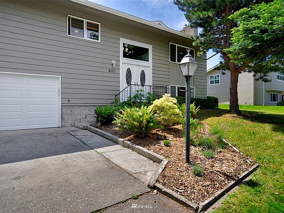 Trees in front provide shade, and great garden space for ferns and other shade-loving plants