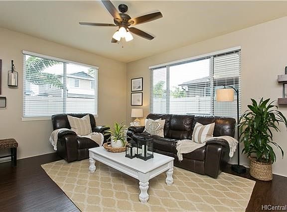 immaculate living area painted in warm neutral colors.