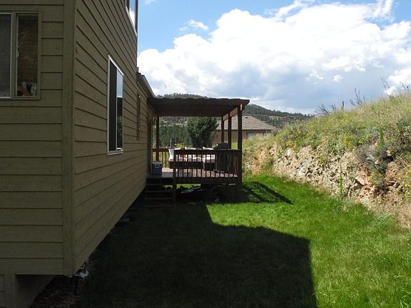 Grass Covered Backyard. House sits on 1/2 Acre total.