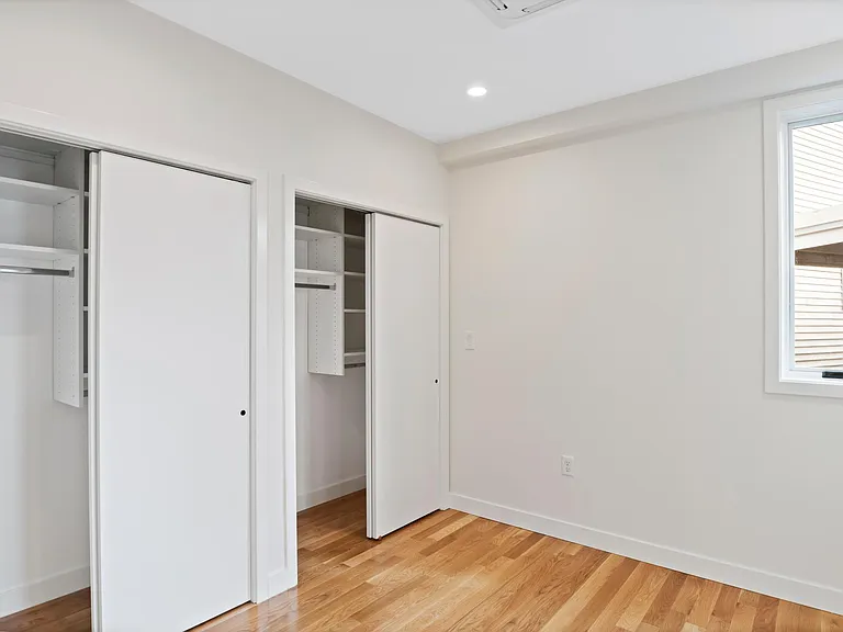 Queen size bedroom with 3 custom built out closets