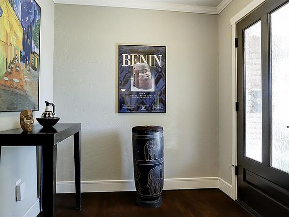 Foyer: Entry hall has room for furniture and artwork and itâs highlighted by 2-light mahogany entry door.