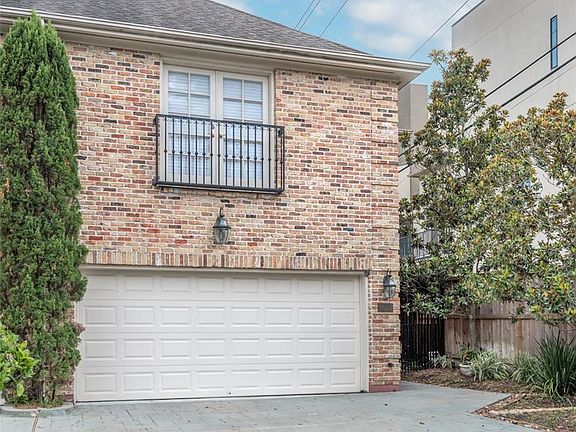 This two story brick townhome has a two car garage and private driveway. This home has patterned concrete and paved walkways as well as gardening space with mature landscaping. There are only two townhomes on this property and there is No HOA cost. C