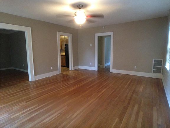 Living Room: enters into dining room, kitchen, & bedrooms.