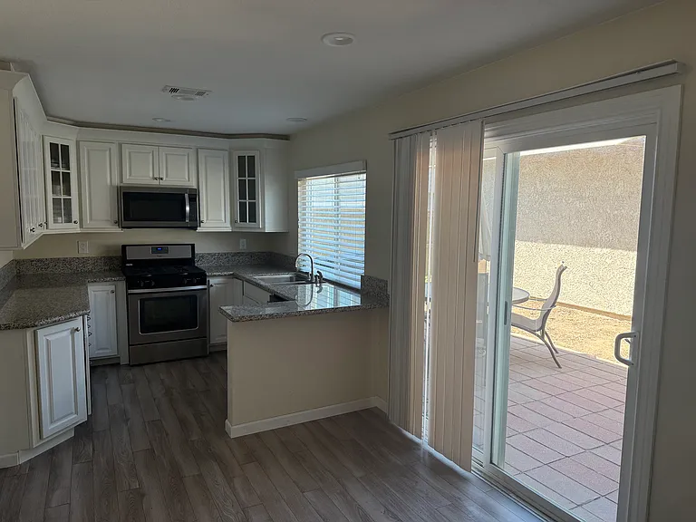 Enjoy your own private backyard with plenty of space for outdoor dining, relaxing, barbequing or gardening. Additional attic storage provides room for seasonal decorations and extra belongings.