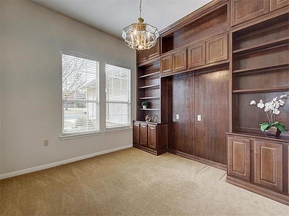 The dedicated study has handsome built-in cabinetry.