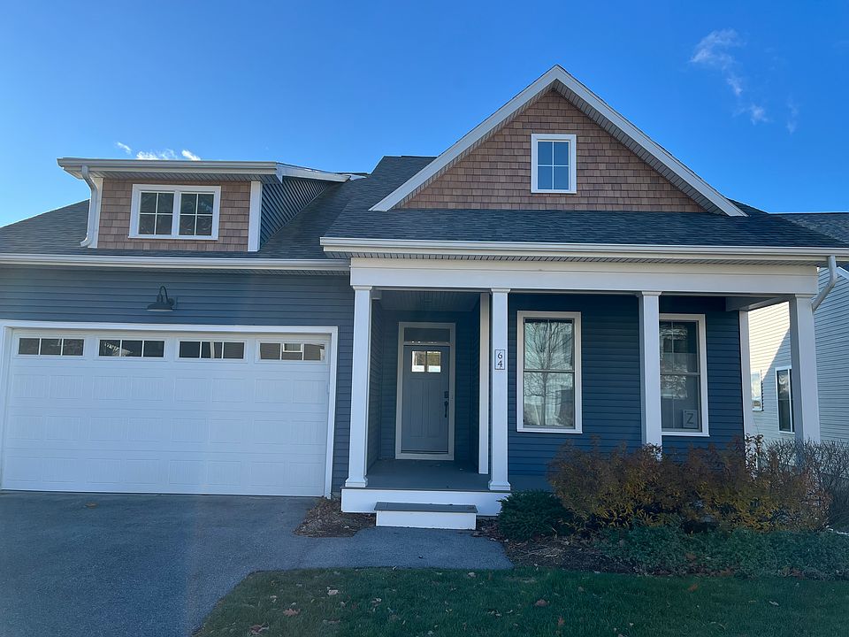 welcoming porch and two car garage