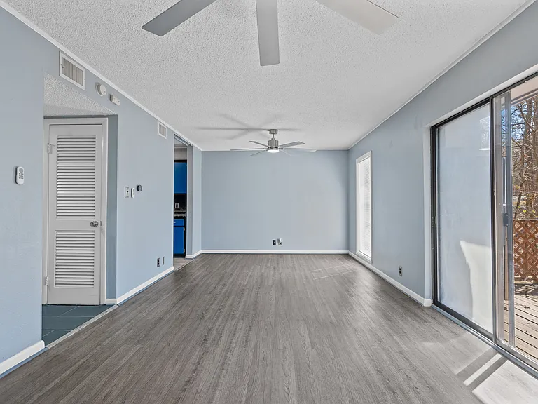 Livingroom leading to Balcony and Kitchen
