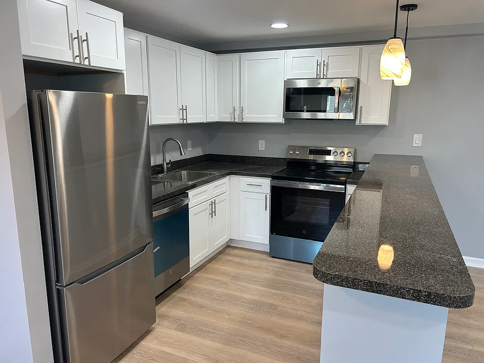 Kitchen with large peninsula with electric outlets